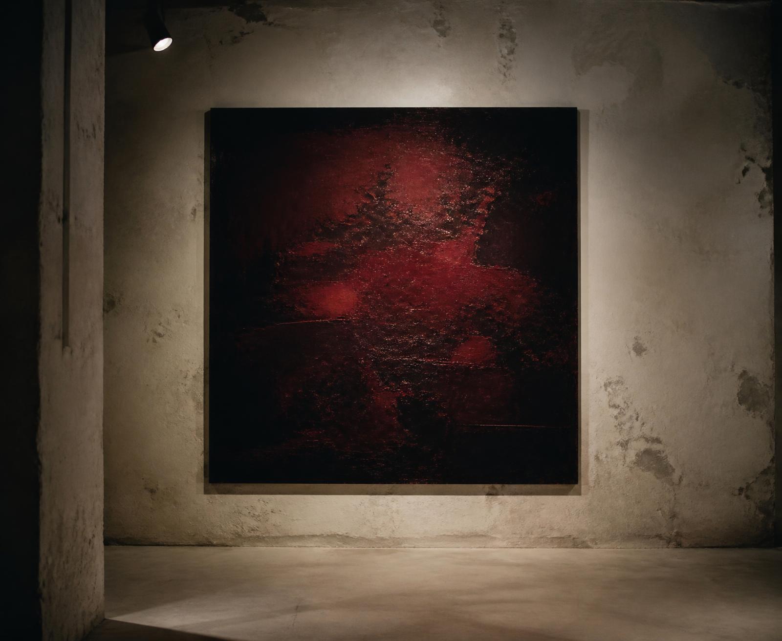 Large dark red canvas in a raw concrete room